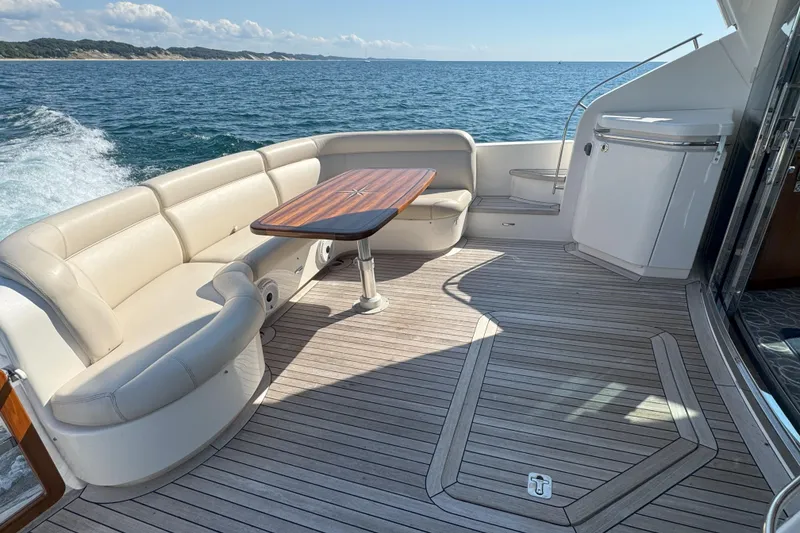 Slide: The Image of Luxurious 2014 Tiara Yachts 5800 Sovran deck with elegant seating and ocean view. - 12