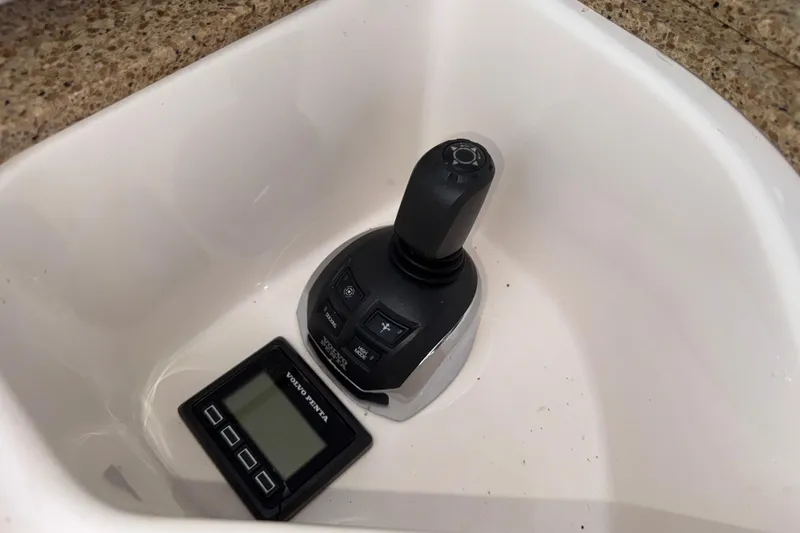 Slide: The Image of Joystick control and display panel in 2014 Tiara Yachts 5800 Sovran. - 16