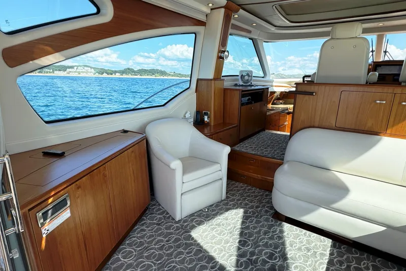 Slide: The Image of Luxurious interior of 2014 Tiara Yachts 5800 Sovran with elegant seating and scenic ocean view. - 20