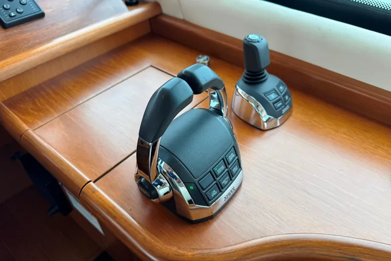 Slide: The Image of Control panel of 2014 Tiara Yachts 5800 Sovran, featuring throttle and joystick. - 30