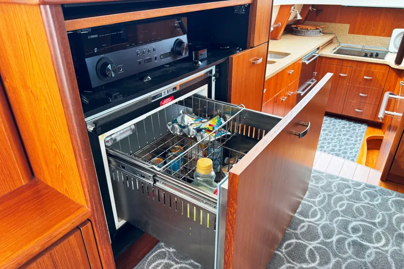 Slide: The Image of 2014 Tiara Yachts 5800 Sovran interior with open drawer and audio system. - 37