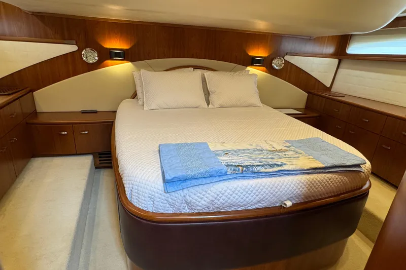 Slide: The Image of Luxurious bedroom interior of 2014 Tiara Yachts 5800 Sovran with elegant wood finishes. - 38