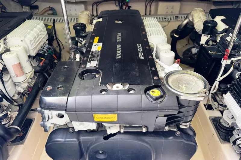 Slide: The Image of Engine room of a 2014 Tiara Yachts 5800 Sovran, featuring a Volvo Penta IPS600 engine. - 56