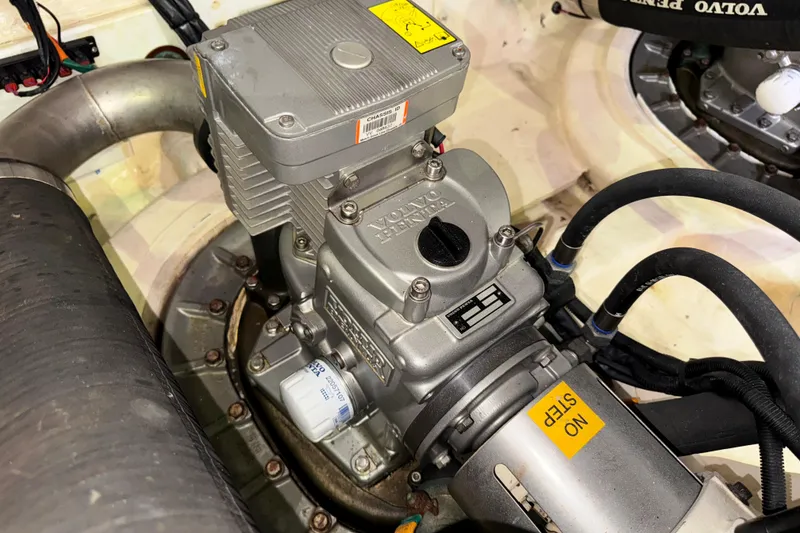 Slide: The Image of Engine compartment of 2014 Tiara Yachts 5800 Sovran, featuring Volvo Penta components. - 59