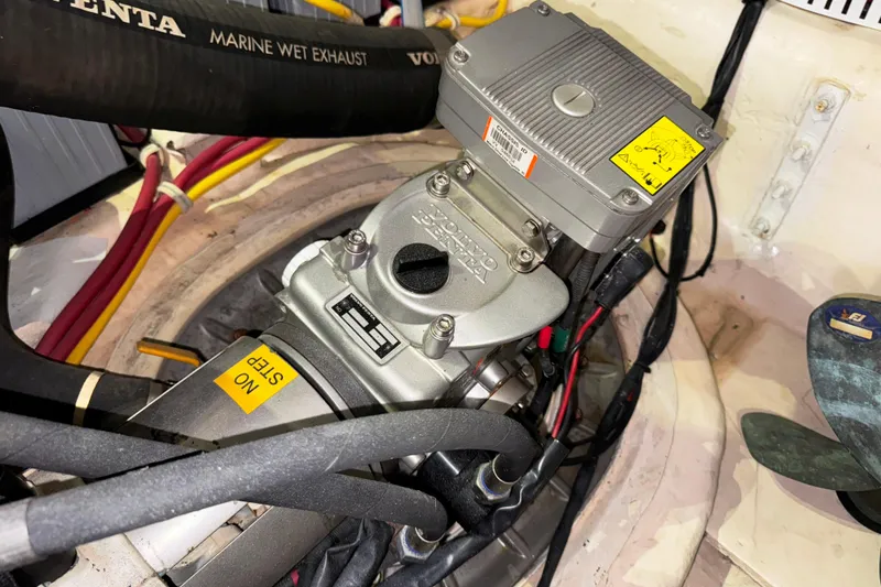 Slide: The Image of Engine compartment of a 2014 Tiara Yachts 5800 Sovran, featuring Volvo Penta components. - 60