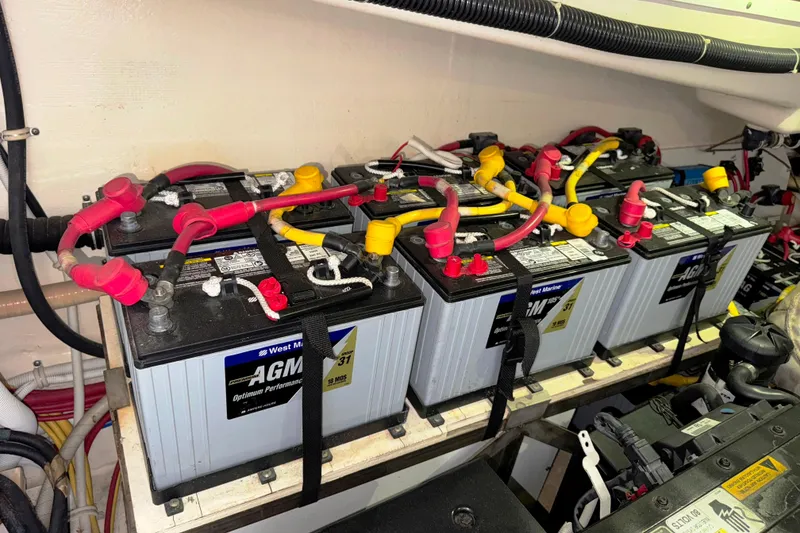 Slide: The Image of AGM batteries in 2014 Tiara Yachts 5800 Sovran engine room, organized and connected. - 67
