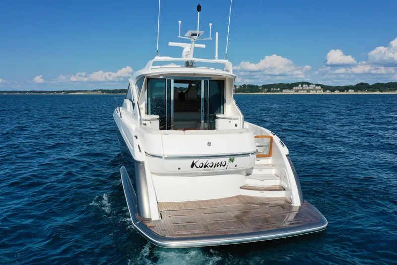 Slide: The Image of 2014 Tiara Yachts 5800 Sovran on open water, rear view with clear skies. - 7