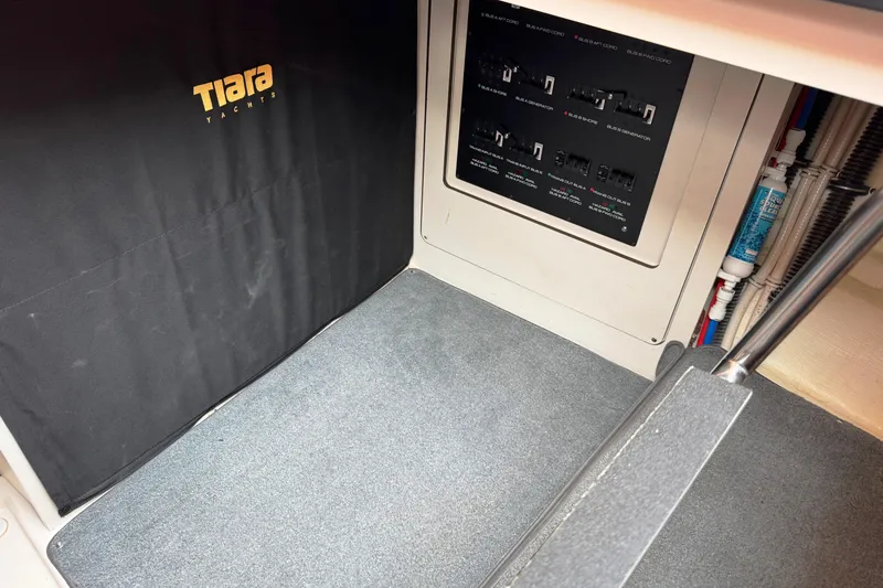 Slide: The Image of Interior view of 2014 Tiara Yachts 5800 Sovran, featuring control panel and carpeted flooring. - 71