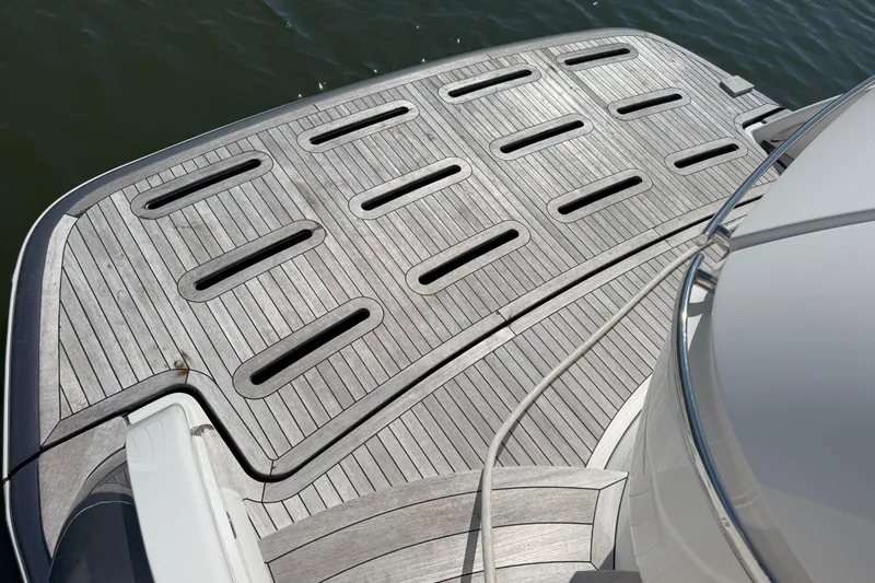 Slide: The Image of 2014 Tiara Yachts 5800 Sovran swim platform with teak decking and water view. - 74