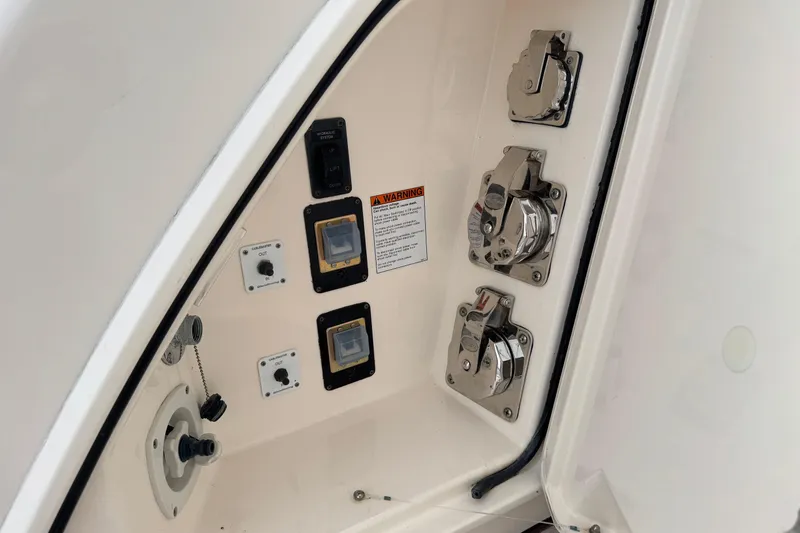 Slide: The Image of Control panel of 2014 Tiara Yachts 5800 Sovran with switches and connectors. - 75