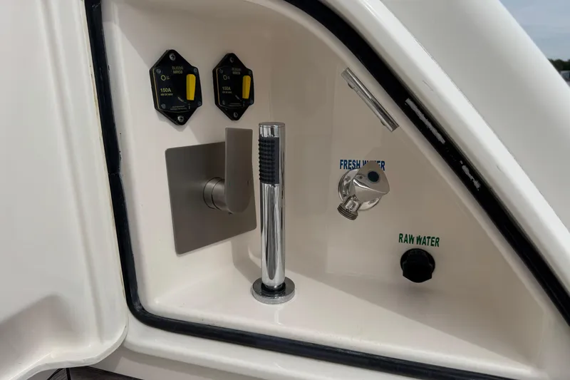 Slide: The Image of Control panel on 2014 Tiara Yachts 5800 Sovran, featuring fresh and raw water switches. - 76