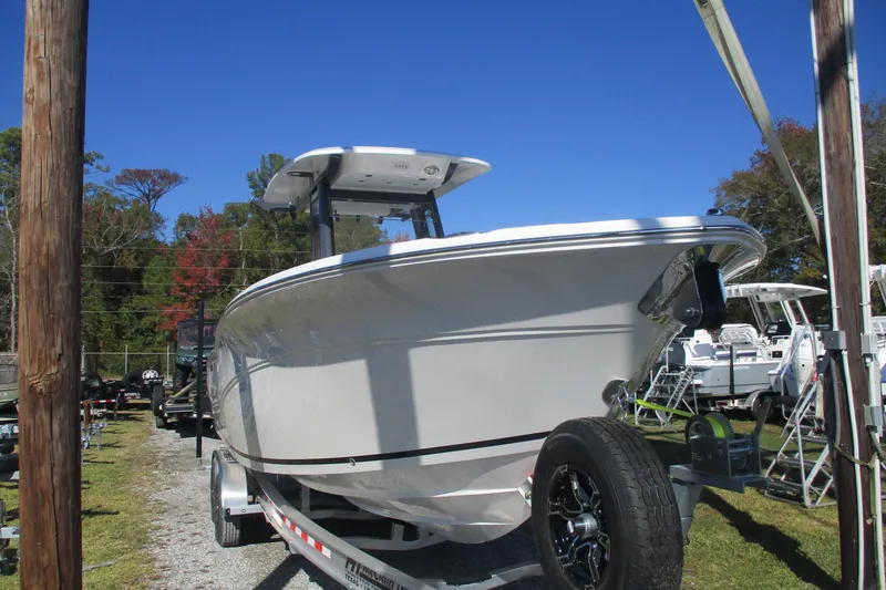 Slide: The Image of 2026 Sea Fox 268 Commander boat on trailer under clear blue sky. - 4