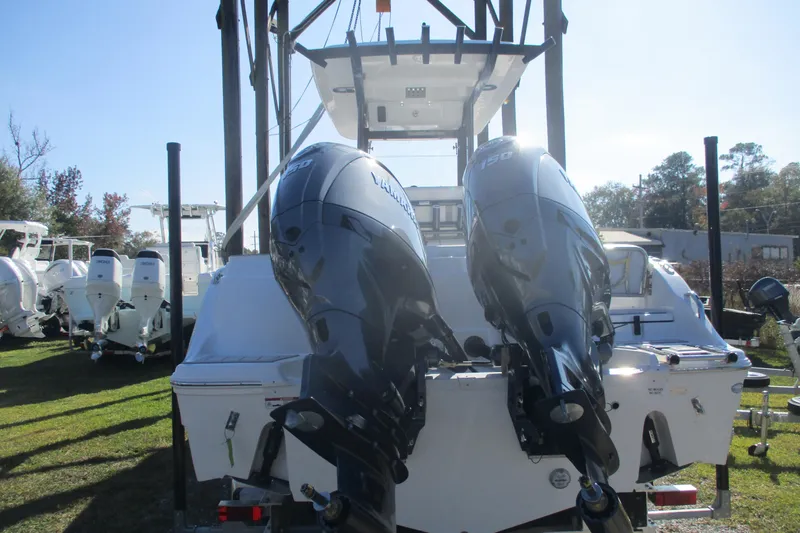 Slide: The Image of 2026 Sea Fox 268 Commander boat with dual outboard engines, displayed outdoors. - 7