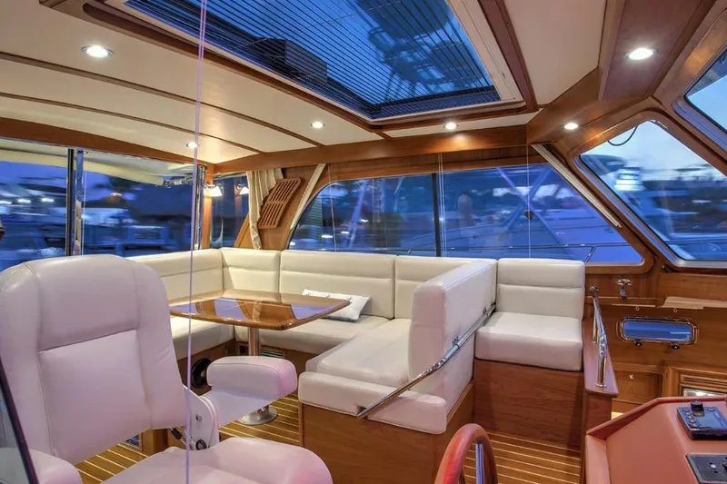 Slide: The Image of Luxurious interior of 2026 Sabre 38 yacht with elegant seating and wooden accents. - 4
