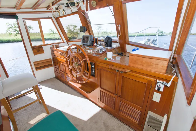 Slide: The Image of Interior of 1980 Kadey-Krogen 42 trawler with wooden helm and navigation equipment. - 30