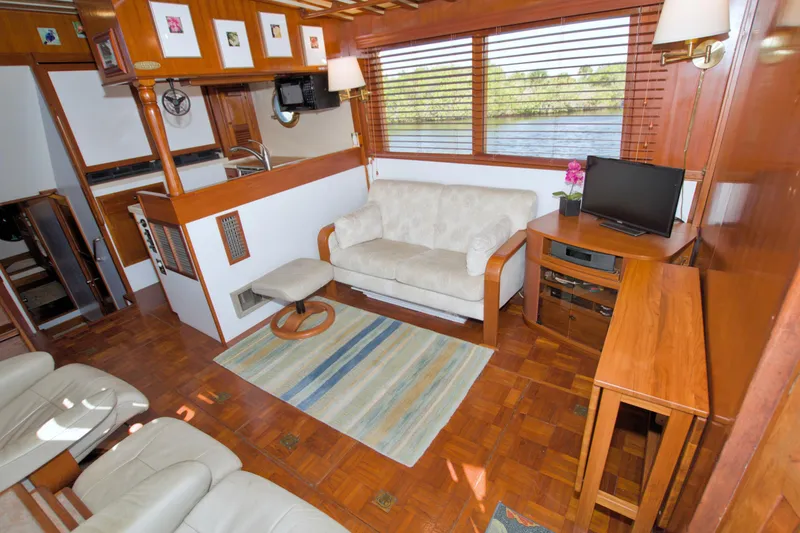 Slide: The Image of Interior of 1980 Kadey-Krogen 42 trawler with cozy seating and wooden decor. - 39