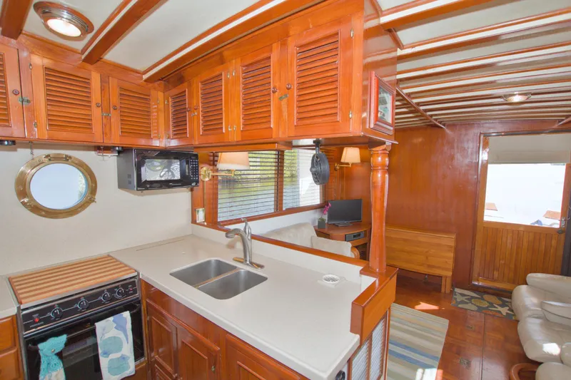 Slide: The Image of Interior of 1980 Kadey-Krogen 42 trawler with wooden cabinetry and modern amenities. - 45