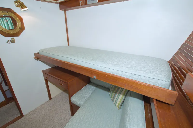 Slide: The Image of Interior of 1980 Kadey-Krogen 42 trawler with bunk beds and wooden furnishings. - 56