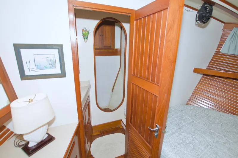 Slide: The Image of Interior of 1980 Kadey-Krogen 42 trawler with wooden door, bed, and decor. - 64