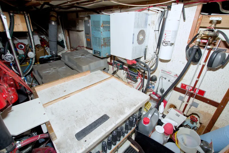 Slide: The Image of Engine room of a 1980 Kadey-Krogen 42 trawler with equipment and storage. - 70