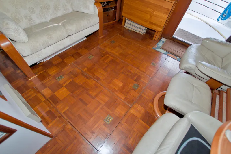 Slide: The Image of Interior of 1980 Kadey-Krogen 42 trawler with wooden flooring and comfortable seating. - 71