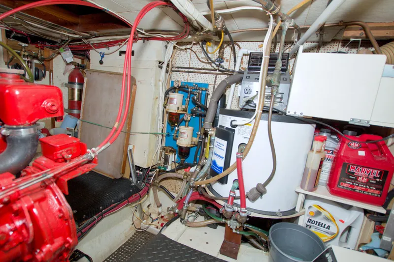 Slide: The Image of Engine room of a 1980 Kadey-Krogen 42 trawler with machinery and equipment. - 81