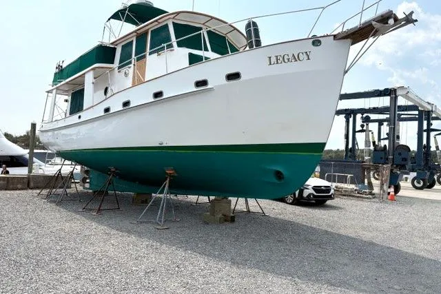 Slide: The Image of 1980 Kadey-Krogen 42 trawler "Legacy" on dry dock, green and white hull. - 89