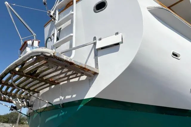 Slide: The Image of 1980 Kadey-Krogen 42 trawler stern view with swim platform and ladder. - 92