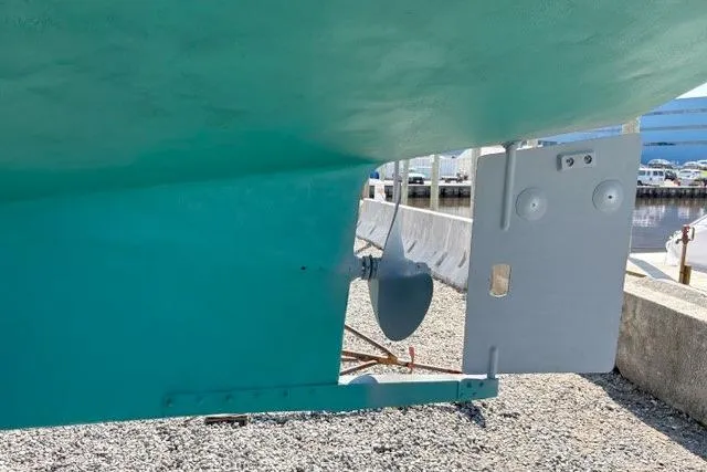 Slide: The Image of Bottom view of a 1980 Kadey-Krogen 42 trawler, showcasing the propeller and rudder. - 94