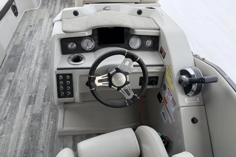 Slide: The Image of Steering console of 2019 Crest Classic 230 SLC boat with gauges and controls. - 10