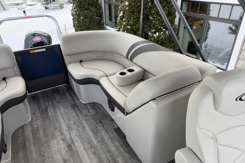 Slide: The Image of 2019 Crest Classic 230 SLC boat interior with plush seating and cup holders. - 12