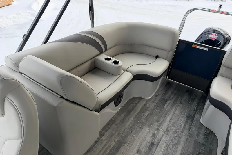 Slide: The Image of 2019 Crest Classic 230 SLC boat interior with gray seating and cup holders. - 13