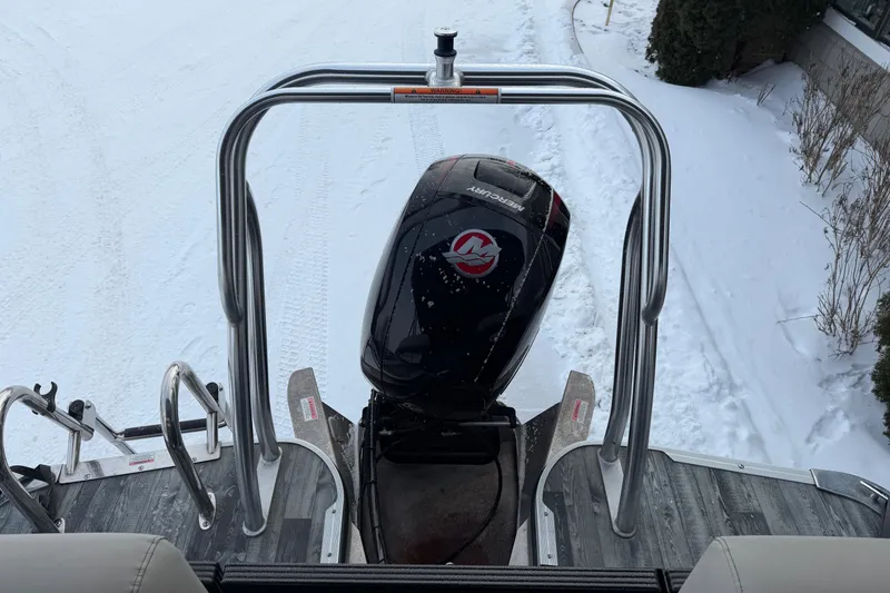 Slide: The Image of 2019 Crest Classic 230 SLC boat with Mercury outboard motor in snowy setting. - 15