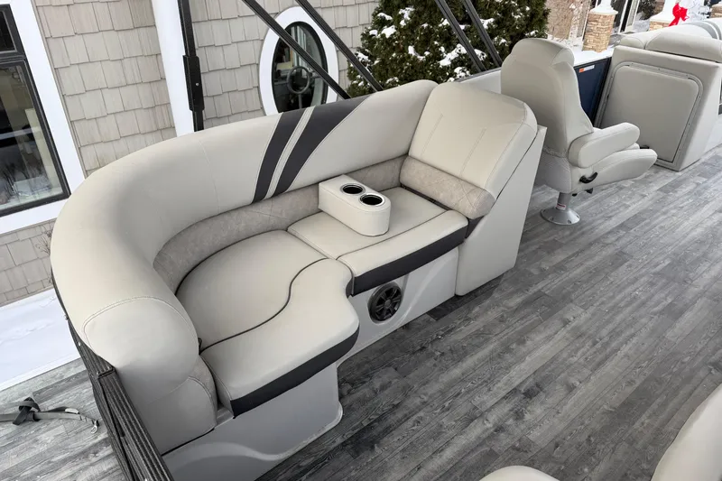 Slide: The Image of 2019 Crest Classic 230 SLC boat interior with plush seating and cup holders. - 17