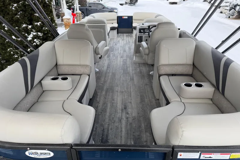 Slide: The Image of 2019 Crest Classic 230 SLC pontoon boat interior with plush seating and cup holders. - 18