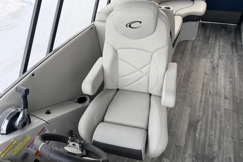 Slide: The Image of Captain's chair on 2019 Crest Classic 230 SLC boat with sleek interior design. - 9