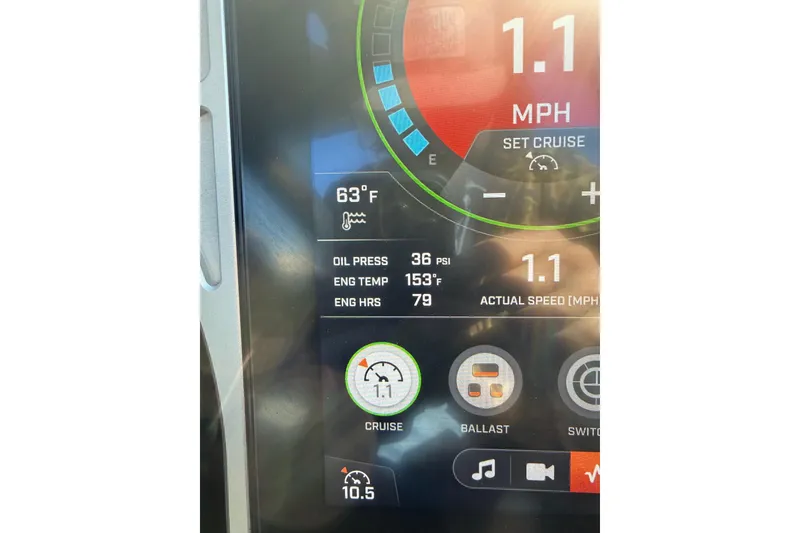 Slide: The Image of 2022 Tigé Z1 dashboard display showing speed, oil pressure, and engine temperature. - 9