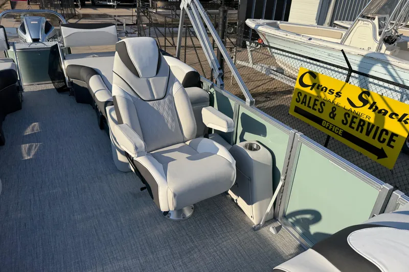 Slide: The Image of 2026 Avalon LSZ Quad Lounger Shift boat interior with luxurious seating at sales and service location. - 11