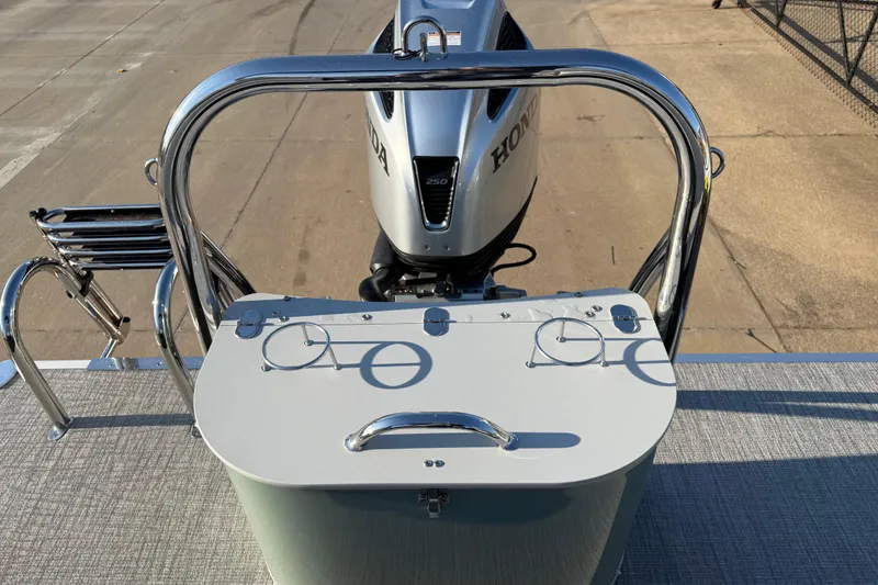 Slide: The Image of 2026 Avalon LSZ Quad Lounger Shift boat with Honda engine, rear view. - 16