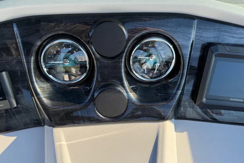 Slide: The Image of Dashboard of 2026 Avalon LSZ Quad Lounger Shift with gauges and Garmin display. - 21