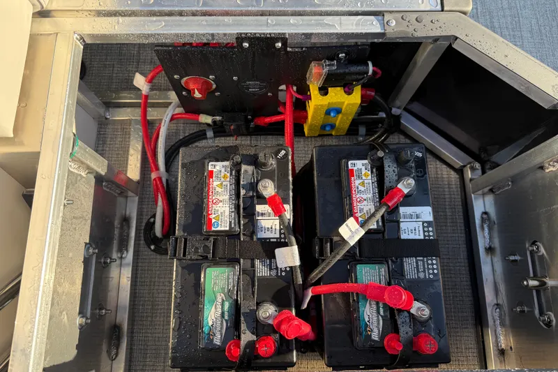 Slide: The Image of Battery compartment of 2026 Avalon LSZ Quad Lounger Shift with wiring and connectors. - 26