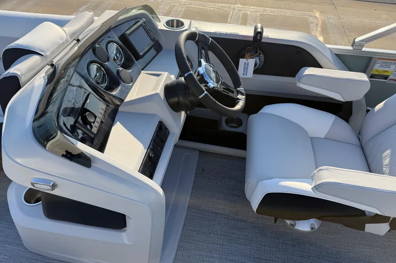 Slide: The Image of 2026 Avalon LSZ Quad Lounger Shift boat cockpit with modern steering and controls. - 31