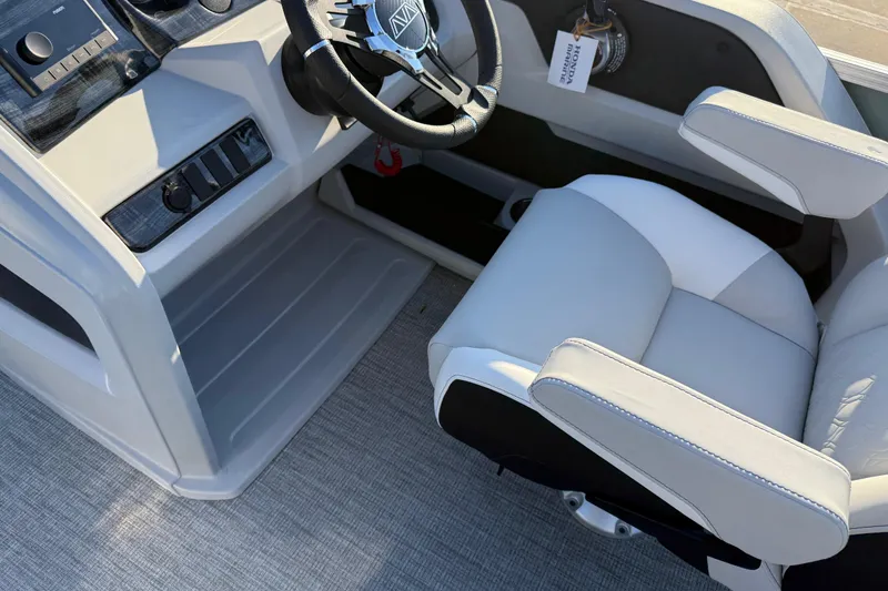 Slide: The Image of 2026 Avalon LSZ Quad Lounger Shift boat interior with steering wheel and plush seating. - 33