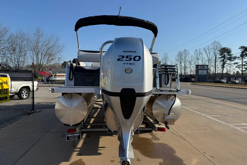 Slide: The Image of 2026 Avalon LSZ Quad Lounger Shift with Honda 250 VTEC engine, parked outdoors. - 5