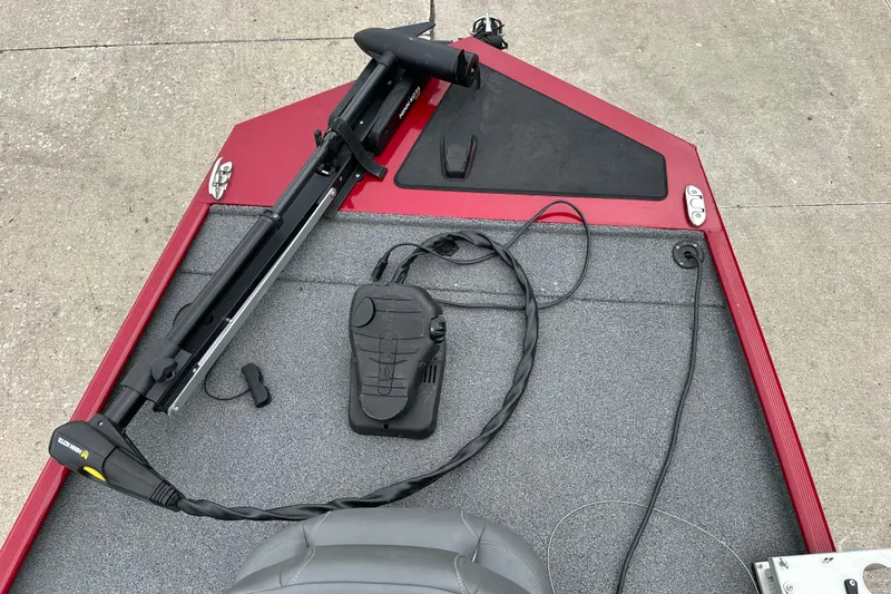 Slide: The Image of 2024 Tracker Bass Tracker Classic XL boat deck with trolling motor and foot pedal. - 3