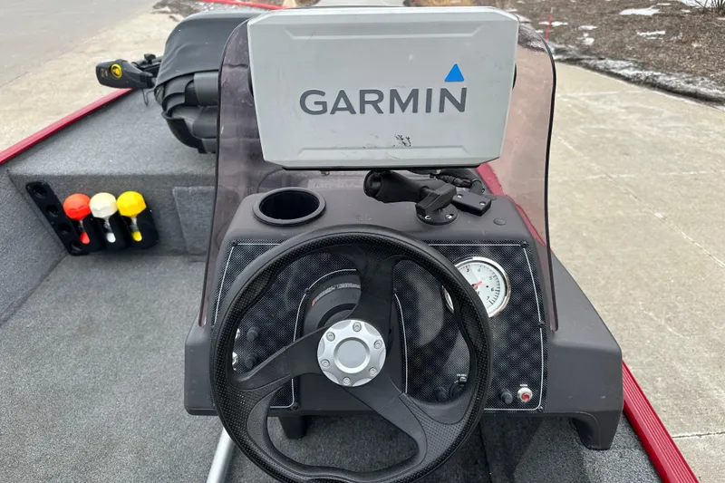 Slide: The Image of 2024 Tracker Bass Tracker Classic XL boat dashboard with Garmin GPS and steering wheel. - 5