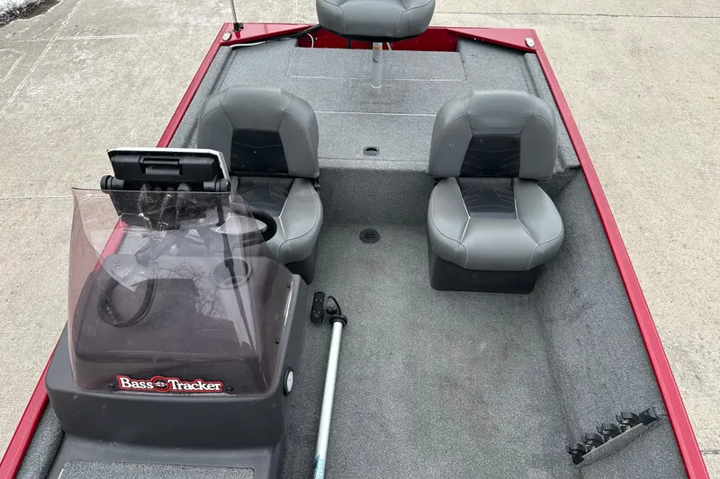 Slide: The Image of 2024 Tracker Bass Tracker Classic XL boat interior with seating and steering console. - 6