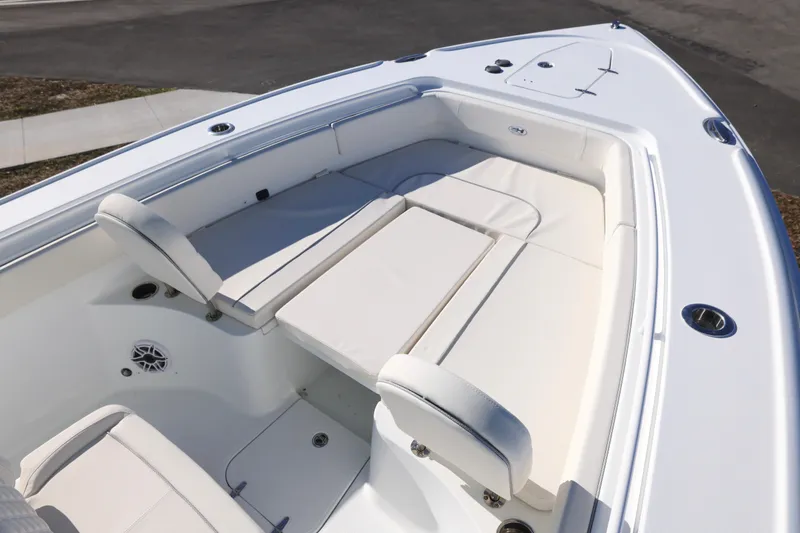 Slide: The Image of 2026 Sea Hunt Ultra 275 SE boat with spacious white seating area. - 11