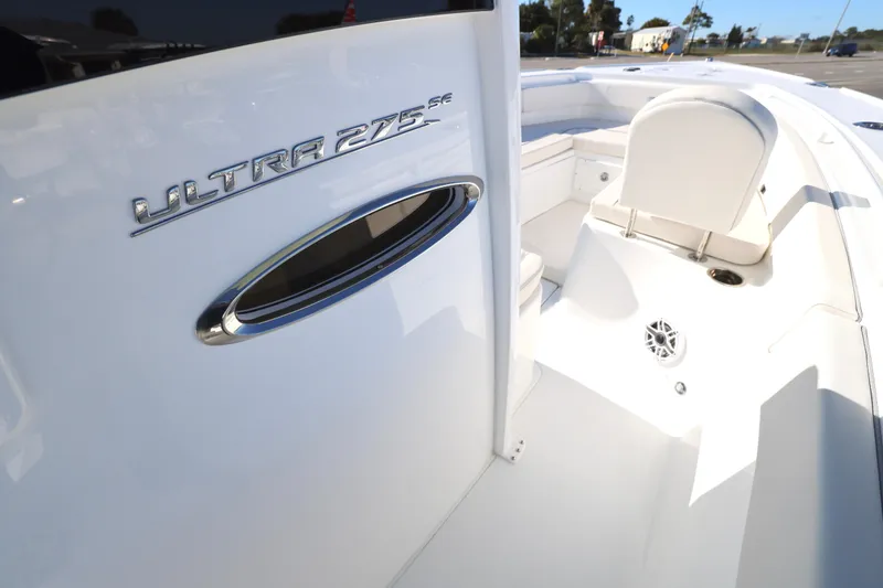Slide: The Image of 2026 Sea Hunt Ultra 275 SE boat interior, showcasing sleek design and seating area. - 14