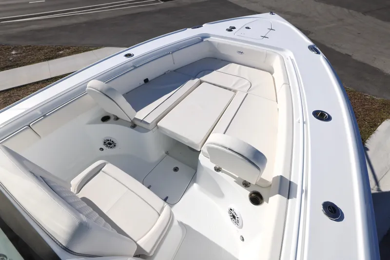 Slide: The Image of 2026 Sea Hunt Ultra 275 SE boat interior with white seating and spacious layout. - 2